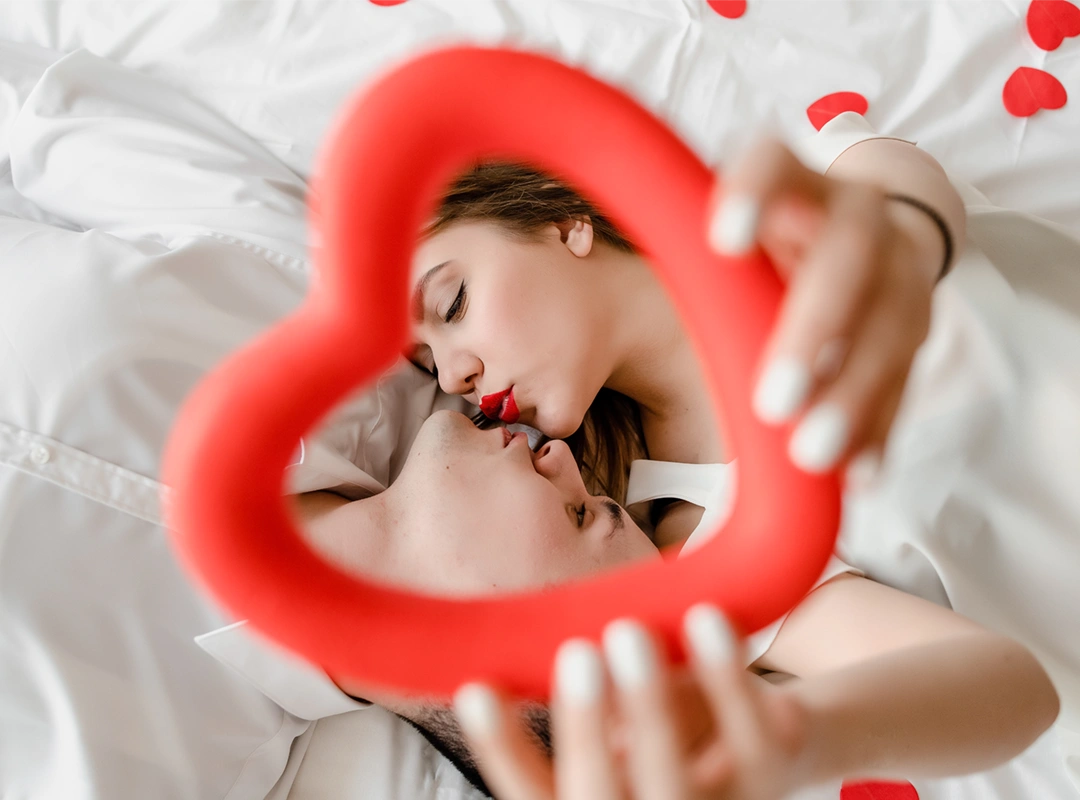 man-woman-love-bed-with-heart-shaped-confetti_28_11zon